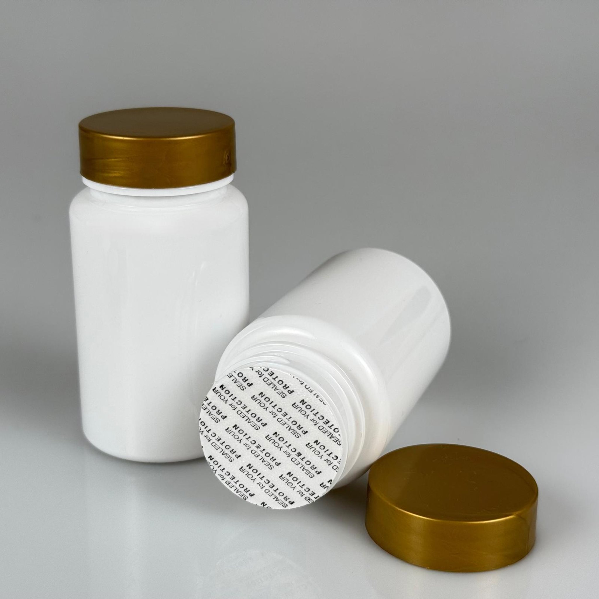 100 CC BEYAZ PET TABLET ŞİŞESİ - GOLD KAPAKLI + KENDİNDEN YAPIŞKANLI KÖPÜK CONTALI - 100 ML KAPSÜL KUTUSU - İLAÇ ŞİŞESİ - MEDİKAL HAP ŞİŞESİ - FARMASÖTİK KAVANOZ
