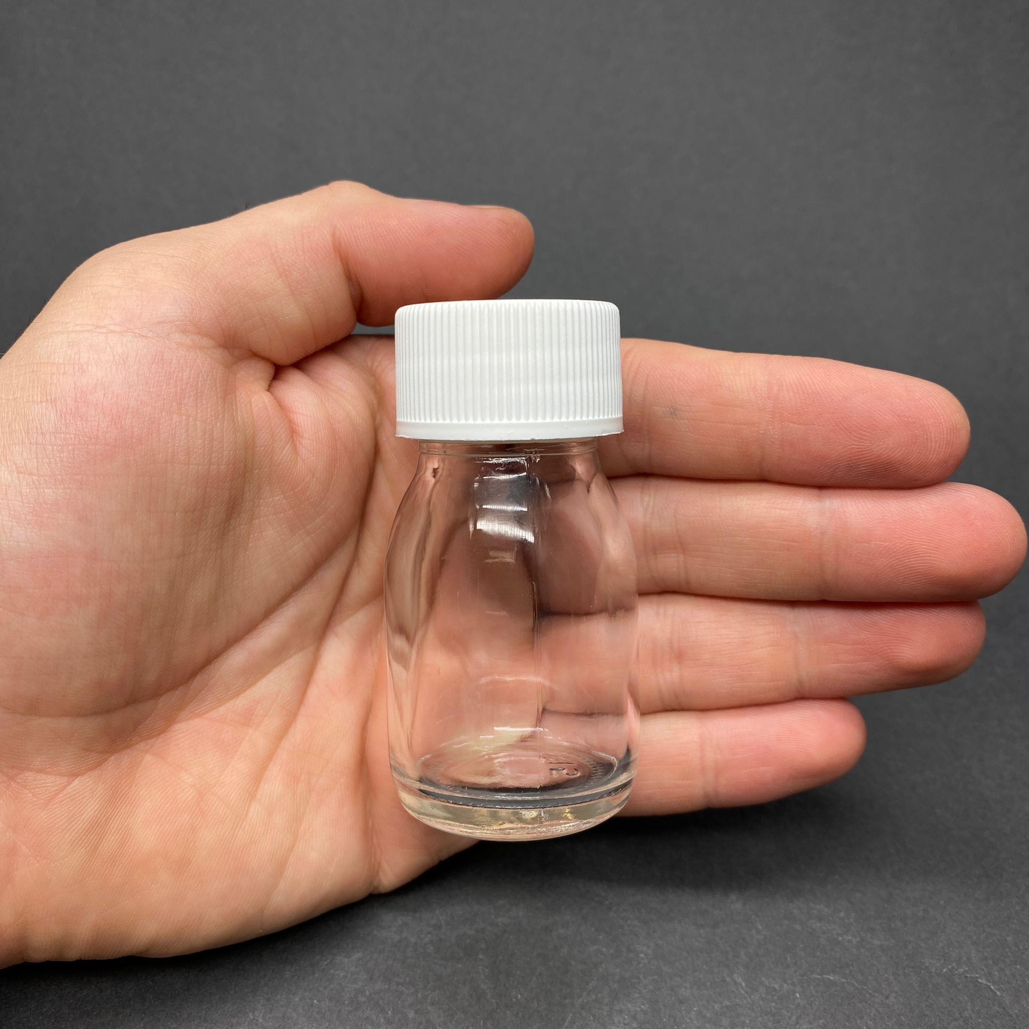 30 CC GENİŞ AĞIZLI ŞEFFAF CAM ŞİŞE - BEYAZ KAPAKLI - 30 ML CAM ŞİŞE - MİKROPLARDAN KORUNMASI İÇİN İLAÇLANMIŞTIR, SUYA TUTUNCA ŞEFFAF RENGİ ALIR