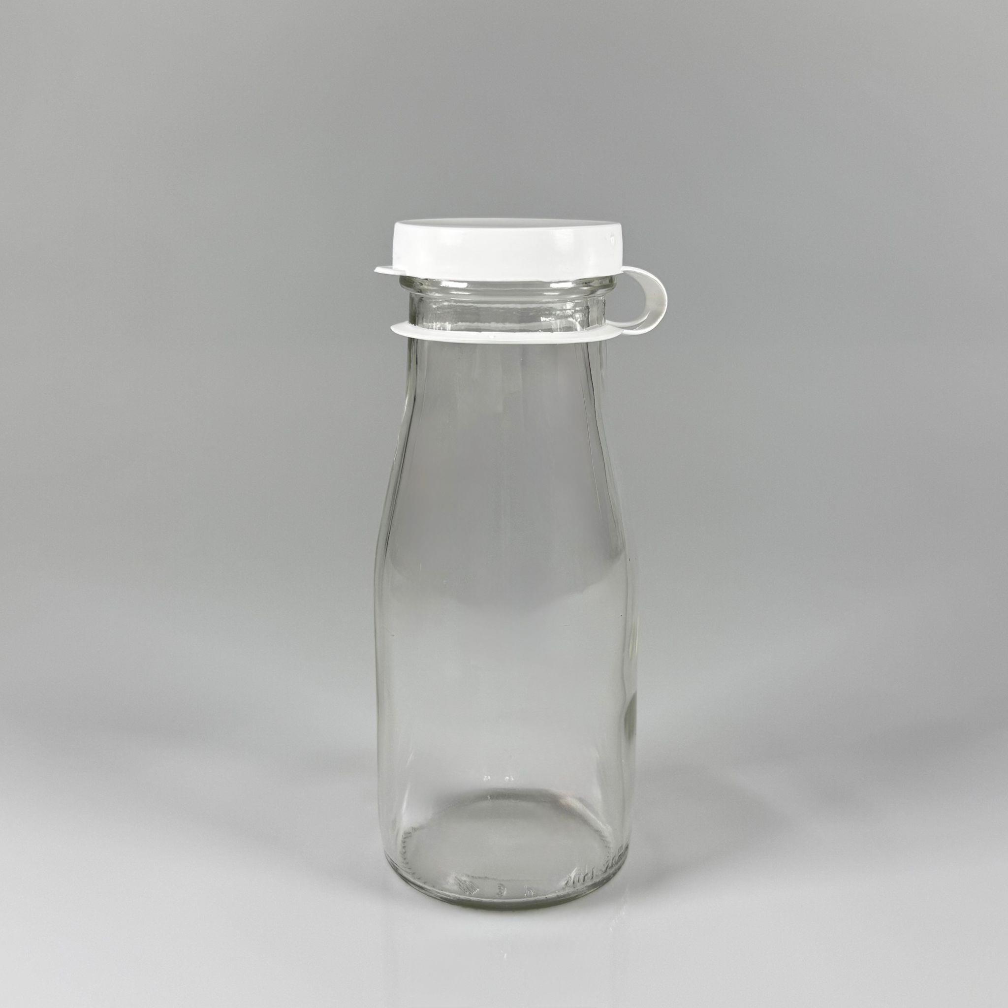 NOSTALJİ ESKİ TİP CAM AYRAN ŞİŞESİ - SÜT, LİMONATA, ŞIRA. ŞERBET. MEYVE SUYU, EV YAPIMI MEŞRUBAT, SMOOTHIE, KOKTEYL VB KAFETERYA, RESTORAN, EV KULLANIMI VB İÇİN - BEYAZ GEÇME KAPAKLI 200 CC BOŞ CAM ŞİŞELERİ