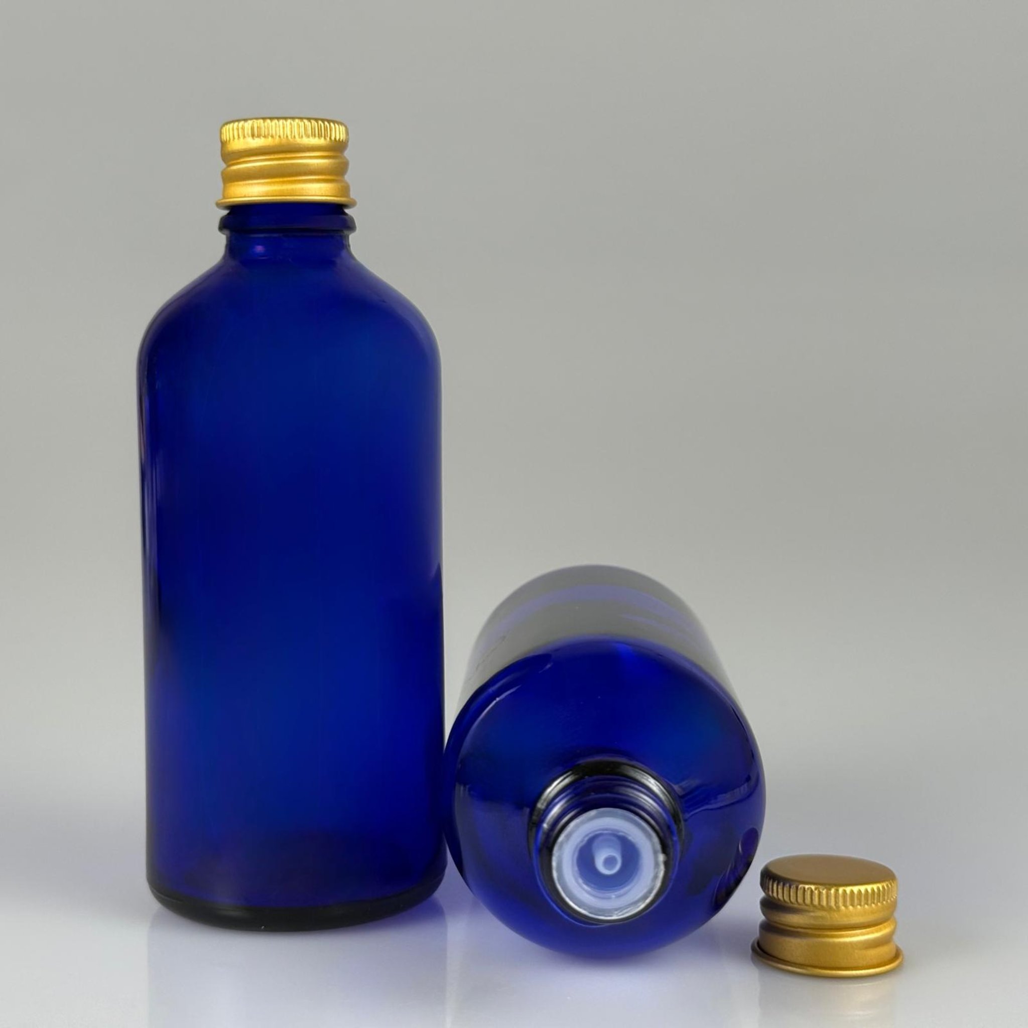 100 CC MAVİ CAM ŞİŞE + KÖPÜK CONTALI GOLD ALÜMİNYUM METAL + DAMLALIKLI KOLONYA TIPALI KAPAKLI TAKIM - 100 ML MAVİ CAM ŞİŞE