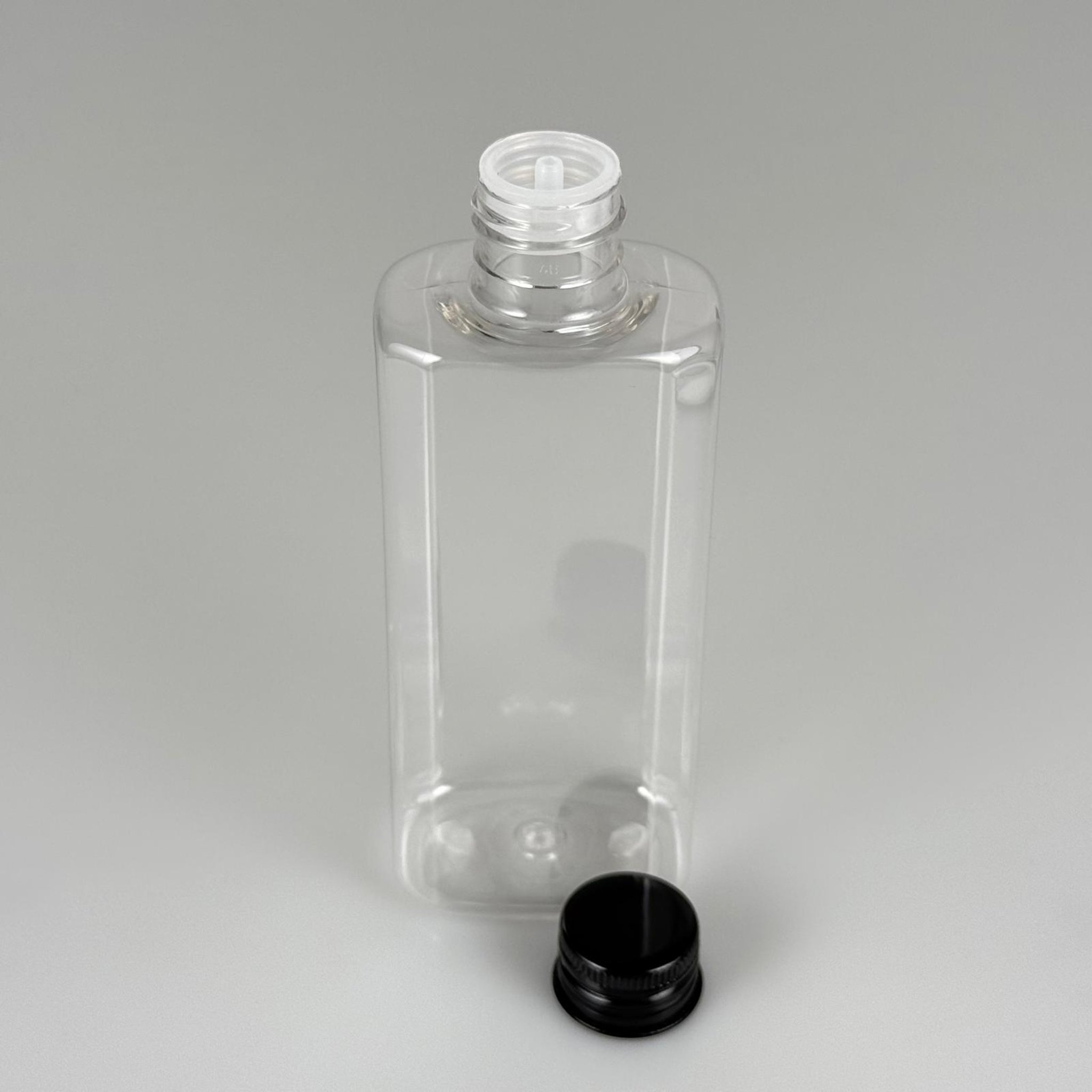 200 CC YASSI MODEL ŞEFFAF PET ŞİŞE (24 AĞIZ) + KÖPÜK CONTALI SİYAH METAL ALÜMİNYUM KAPAK + KOLONYA TIPALI TAKIM - 200 ML KAPAKLI PLASTİK ŞİŞELER