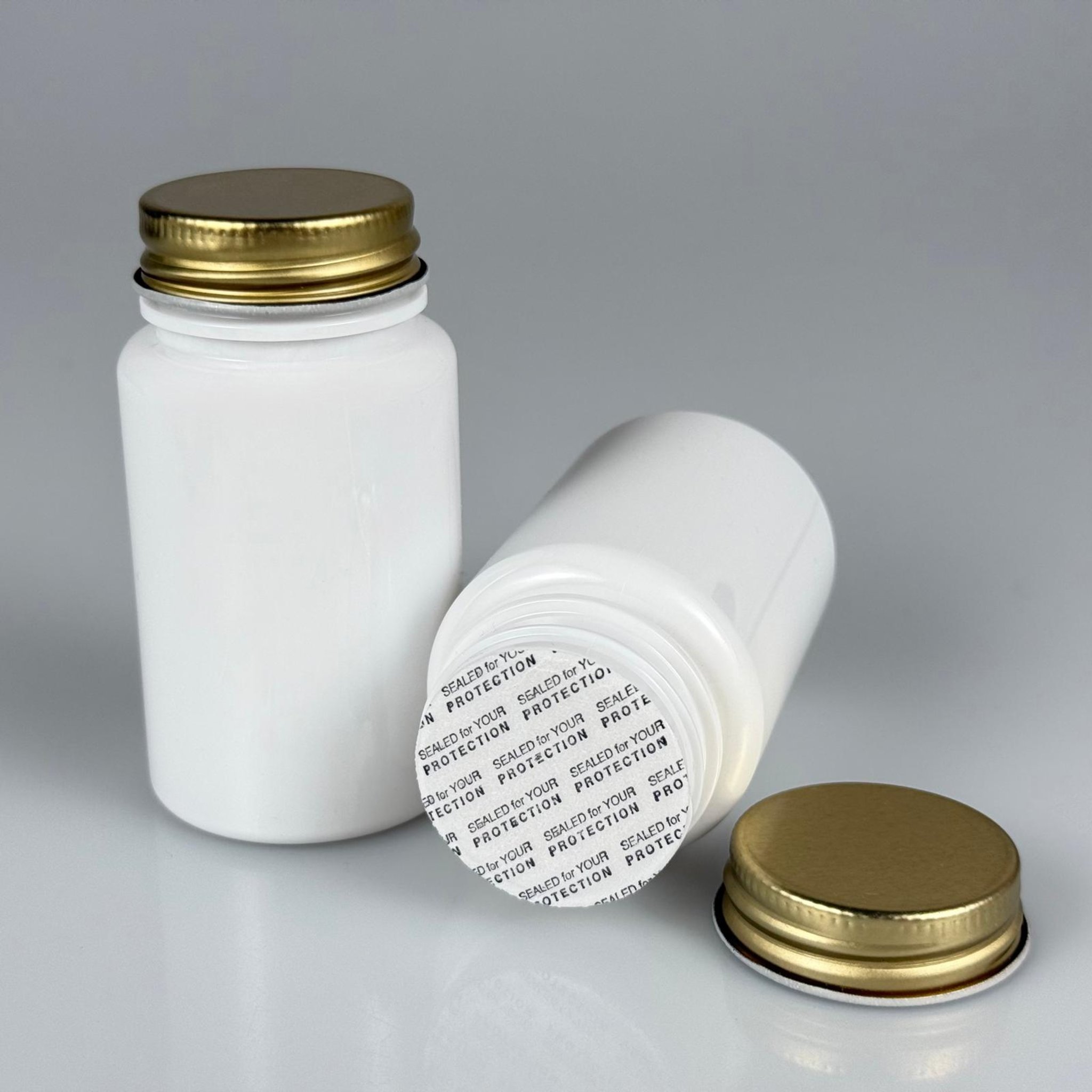 100 CC BEYAZ PET TABLET ŞİŞESİ - GOLD METAL KAPAKLI + KENDİNDEN YAPIŞKANLI KÖPÜK CONTALI - 100 ML KAPSÜL KUTUSU - İLAÇ ŞİŞESİ - MEDİKAL HAP ŞİŞESİ - FARMASÖTİK KAVANOZ