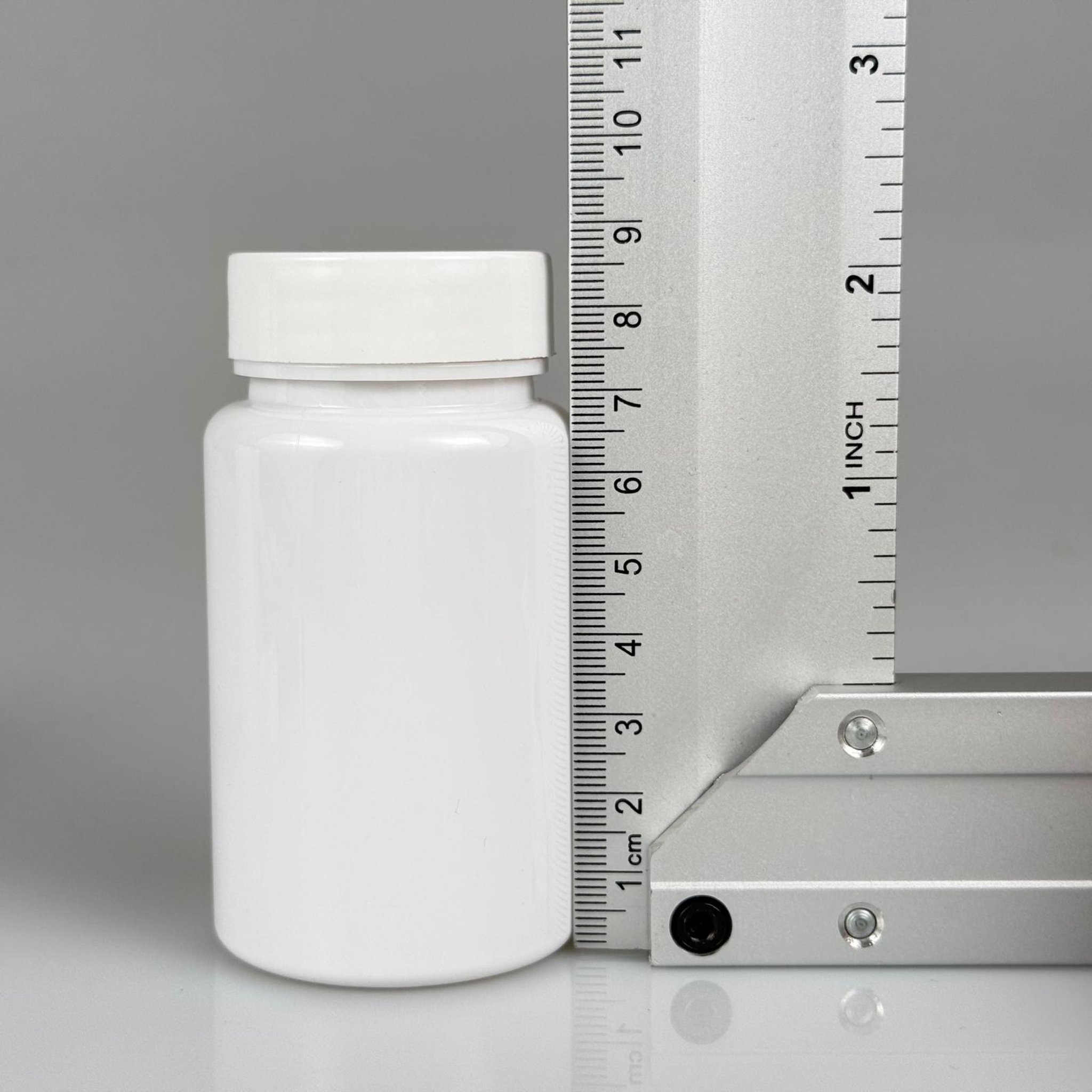 100 CC BEYAZ PET TABLET ŞİŞESİ - BEYAZ KAPAKLI + KENDİNDEN YAPIŞKANLI KÖPÜK CONTALI - 100 ML KAPSÜL KUTUSU - İLAÇ ŞİŞESİ - MEDİKAL HAP ŞİŞESİ - FARMASÖTİK KAVANOZ