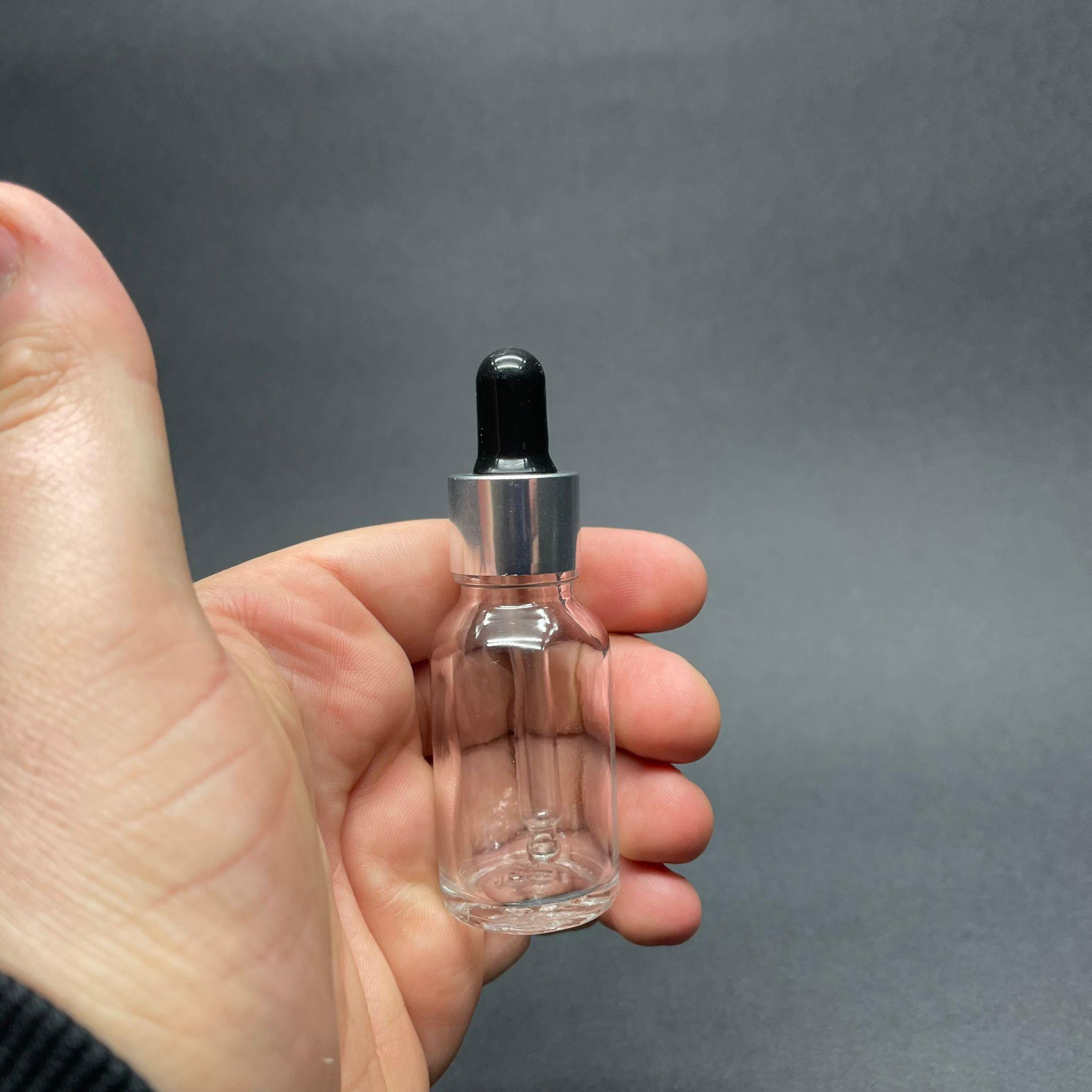 15 CC ŞEFFAF CAM DAMLALIKLI ŞİŞE - SİYAH EMZİK - GÜMÜŞ METAL KAPAK - 15 ML CAM DAMLALIKLI ŞİŞE