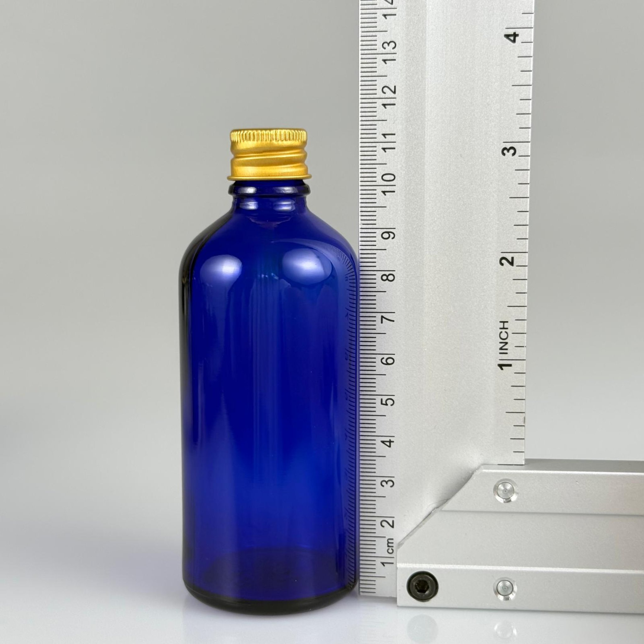 100 CC MAVİ CAM ŞİŞE + KÖPÜK CONTALI GOLD ALÜMİNYUM METAL + DAMLALIKLI KOLONYA TIPALI KAPAKLI TAKIM - 100 ML MAVİ CAM ŞİŞE