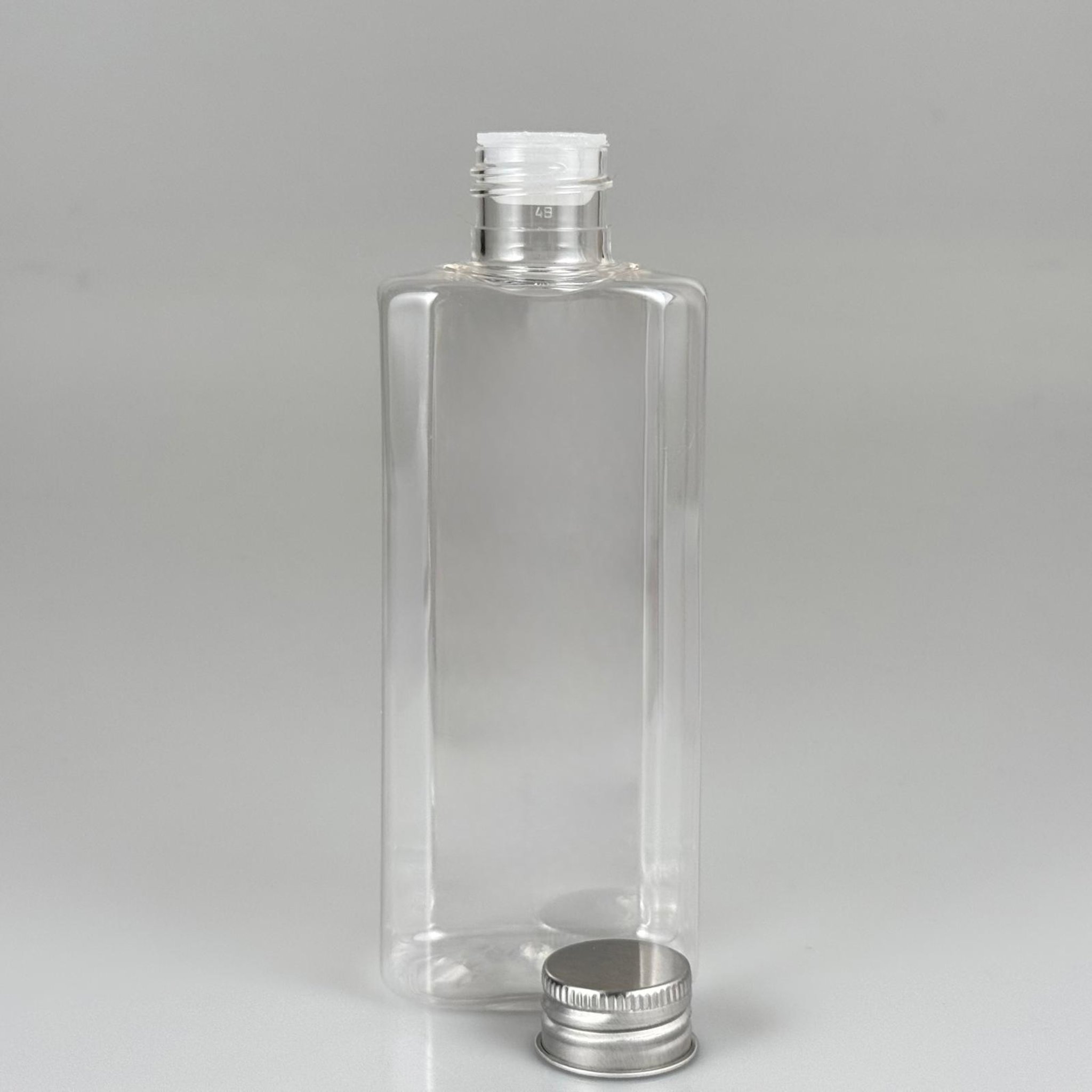 200 CC YASSI MODEL ŞEFFAF PET ŞİŞE (24 AĞIZ) + KÖPÜK CONTALI GÜMÜŞ METAL ALÜMİNYUM KAPAK KOLONYA TIPALI TAKIM - 200 ML KAPAKLI PLASTİK ŞİŞELER
