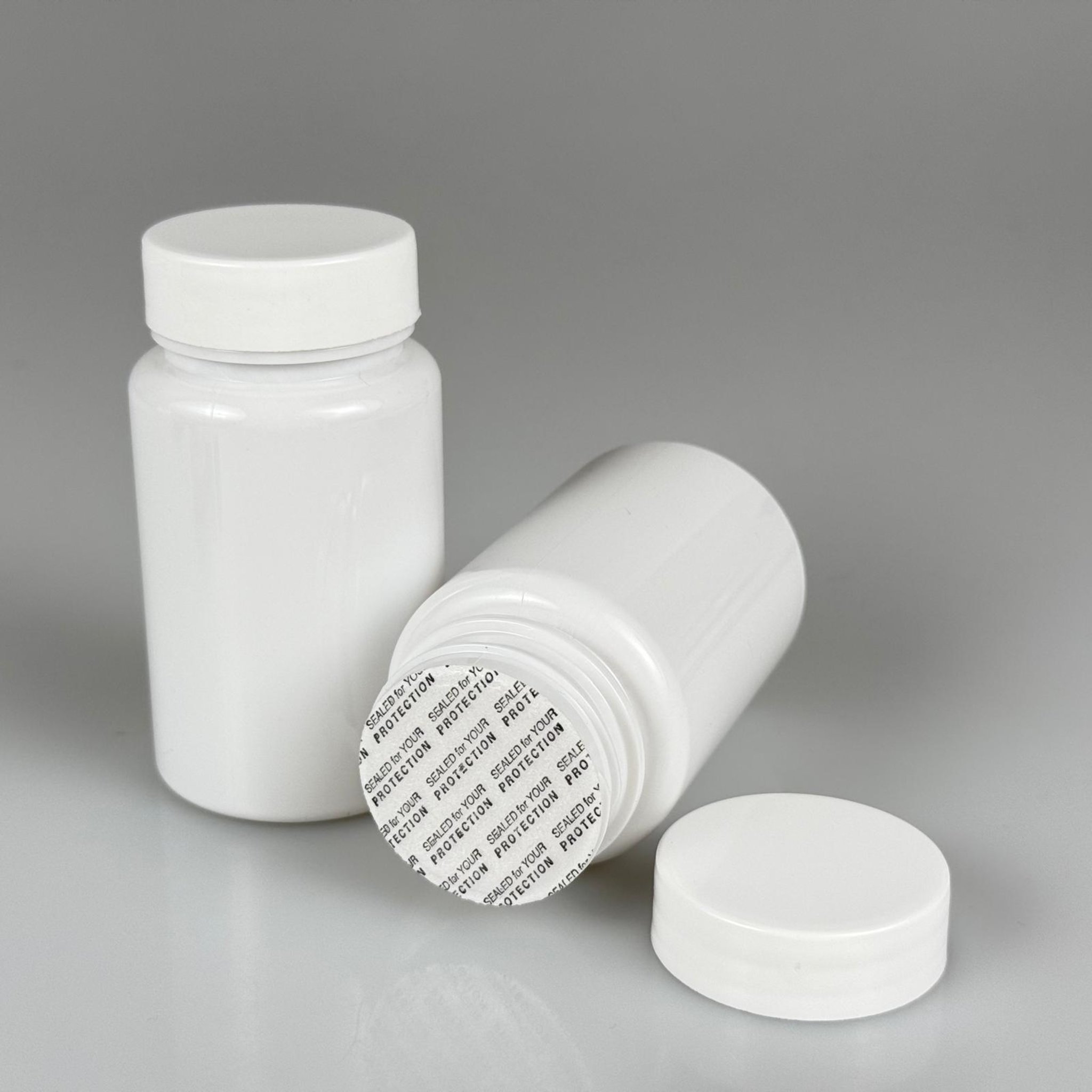 100 CC BEYAZ PET TABLET ŞİŞESİ - BEYAZ KAPAKLI + KENDİNDEN YAPIŞKANLI KÖPÜK CONTALI - 100 ML KAPSÜL KUTUSU - İLAÇ ŞİŞESİ - MEDİKAL HAP ŞİŞESİ - FARMASÖTİK KAVANOZ