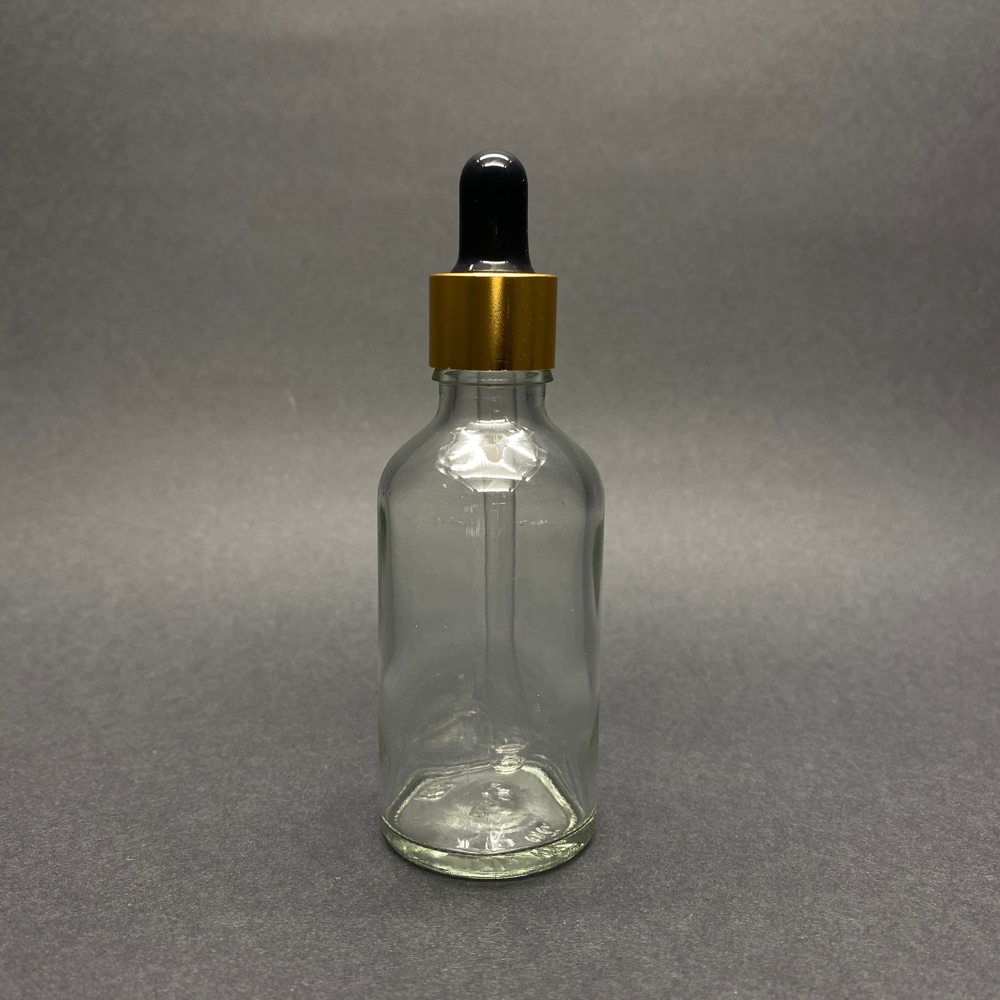 50 CC ŞEFFAF CAM DAMLALIKLI ŞİŞE - SİYAH EMZİK - GOLD METALİK  KAPAK - 50 ML SAYDAM CAM DAMLALIKLI ŞİŞE