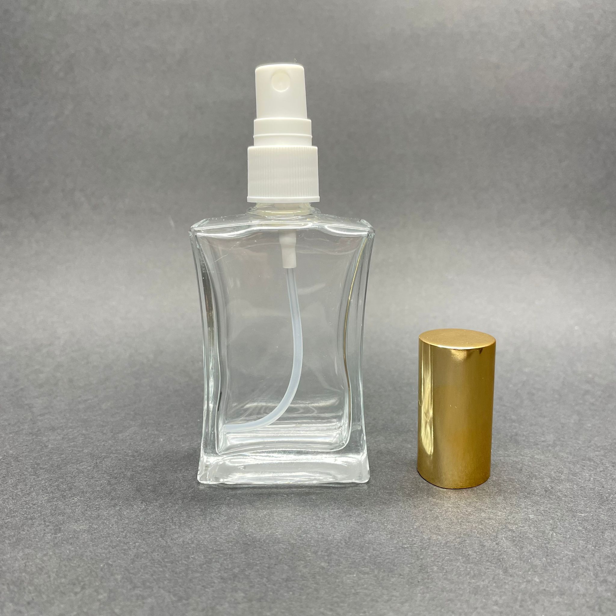 50 CC İNCE BELLİ PARFÜM ŞİŞESİ (DİKDÖRTGEN) GOLD KAPAKLI - SPREYLİ - 50 ML BOŞ PARFÜM ŞİŞESİ - 1. KALİTE İTHAL CAM