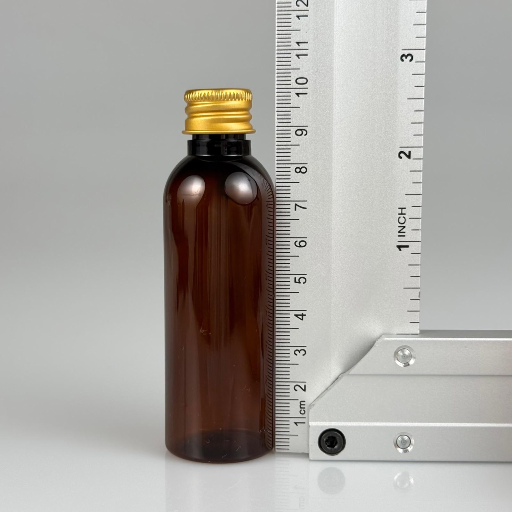 50 CC AMBER SİLİNDİR UZUN MODEL PET ŞİŞE + KÖPÜK CONTALI GOLD ALÜMİNYUM METAL KAPAKLI + KÖR TIPALI TAKIM - 50 ML KAHVERENGİ PLASTİK ŞİŞE