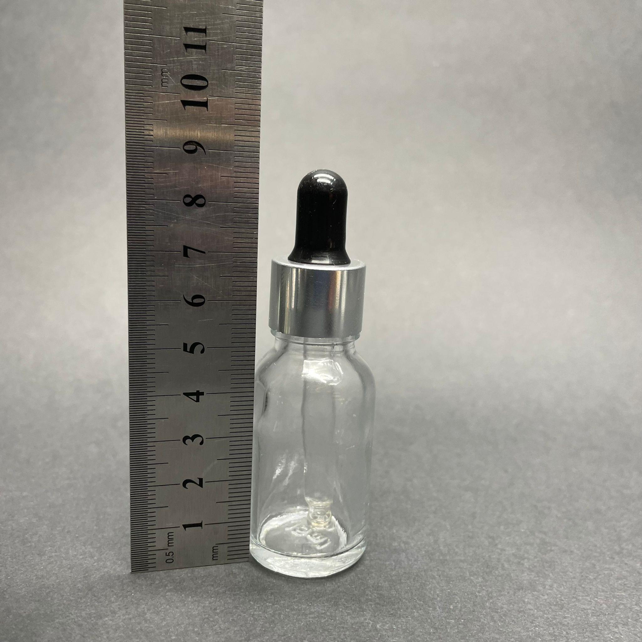 15 CC ŞEFFAF CAM DAMLALIKLI ŞİŞE - SİYAH EMZİK - GÜMÜŞ METAL KAPAK - 15 ML CAM DAMLALIKLI ŞİŞE