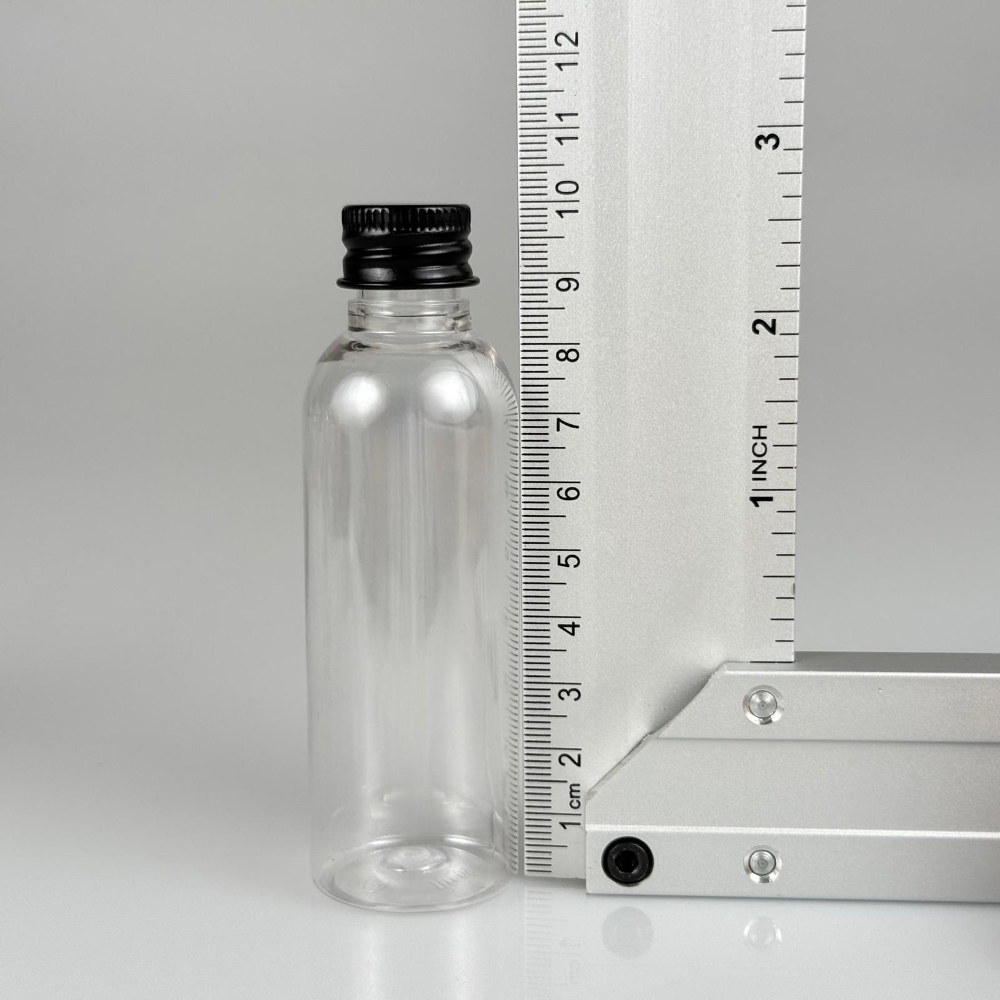 50 CC ŞEFFAF SİLİNDİR UZUN MODEL PET ŞİŞE + KÖPÜK CONTALI SİYAH ALÜMİNYUM METAL KAPAKLI + KÖR TIPALI TAKIM - 50 ML PLASTİK ŞİŞE