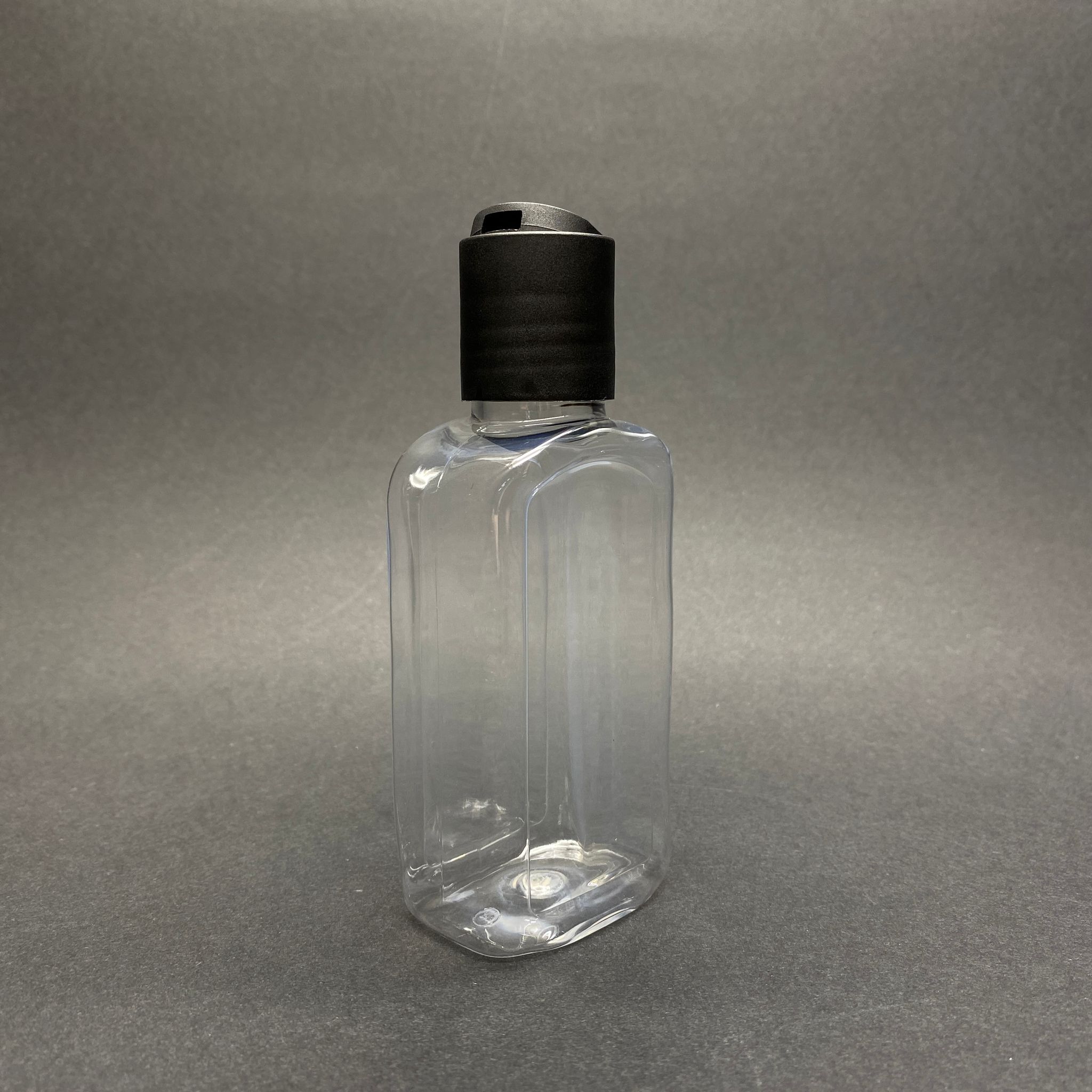 100 CC YASSI MODEL PET ŞİŞE - SİYAH DİSKTOP ŞAMPUAN KAPAKLI - AĞIZ ÇAPI 24 MM - ŞEFFAF